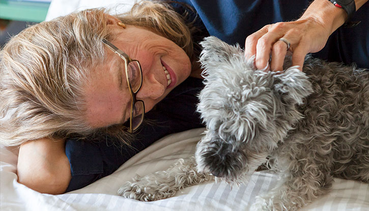 woman petting her dog