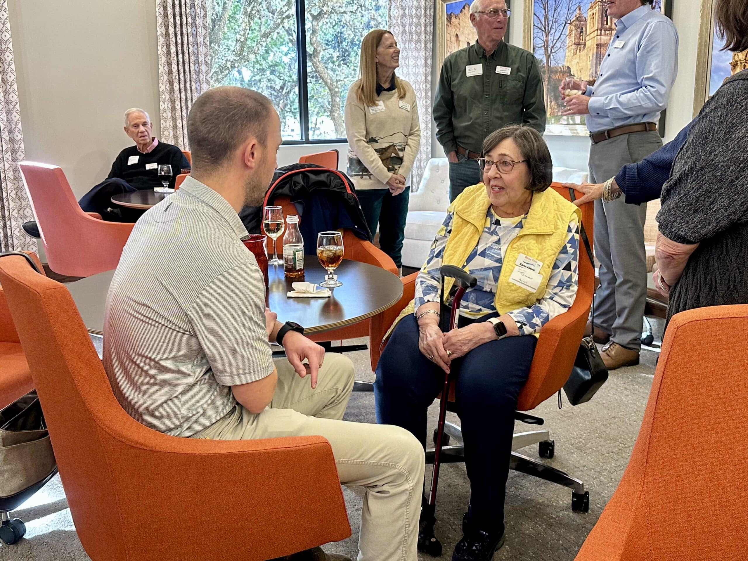 Bella Vida construction site with crews working on site walls, utilities, concrete slabs, and new framing at the Memory Care building, Phase 3 villas, and quadplex foundations.
