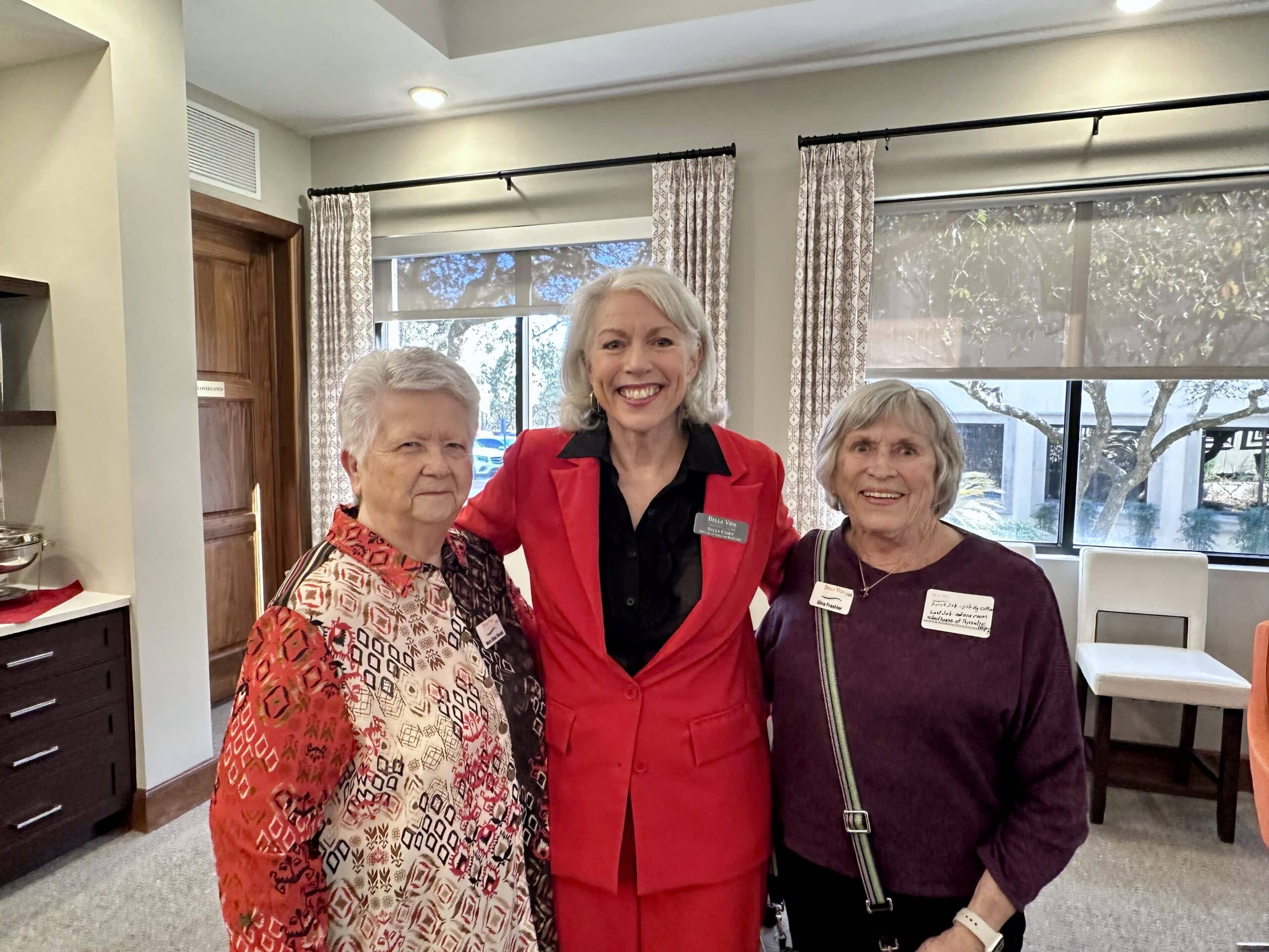 Bella Vida construction site with crews working on site walls, utilities, concrete slabs, and new framing at the Memory Care building, Phase 3 villas, and quadplex foundations.