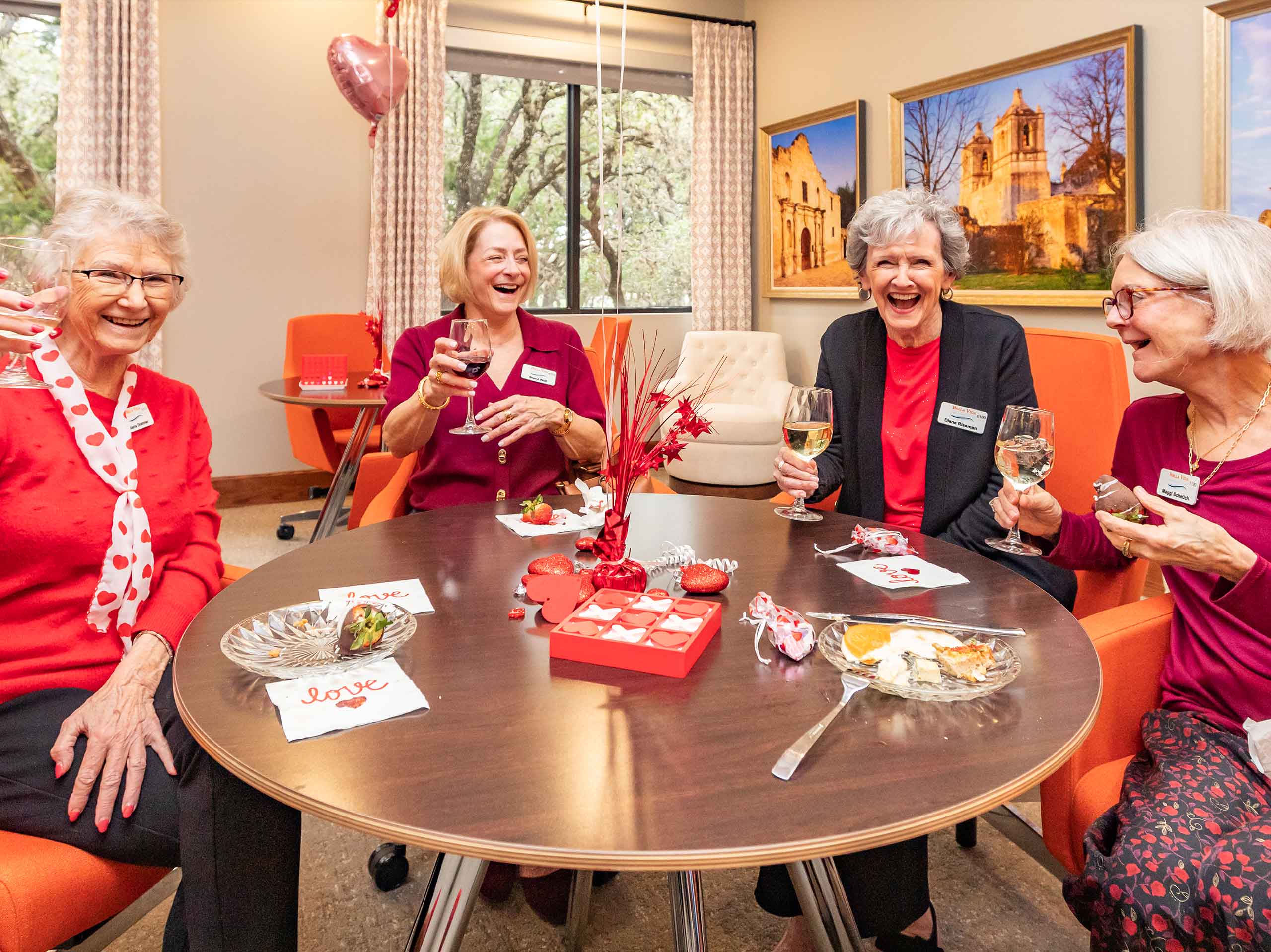 Bella Vida construction site with crews working on site walls, utilities, concrete slabs, and new framing at the Memory Care building, Phase 3 villas, and quadplex foundations.