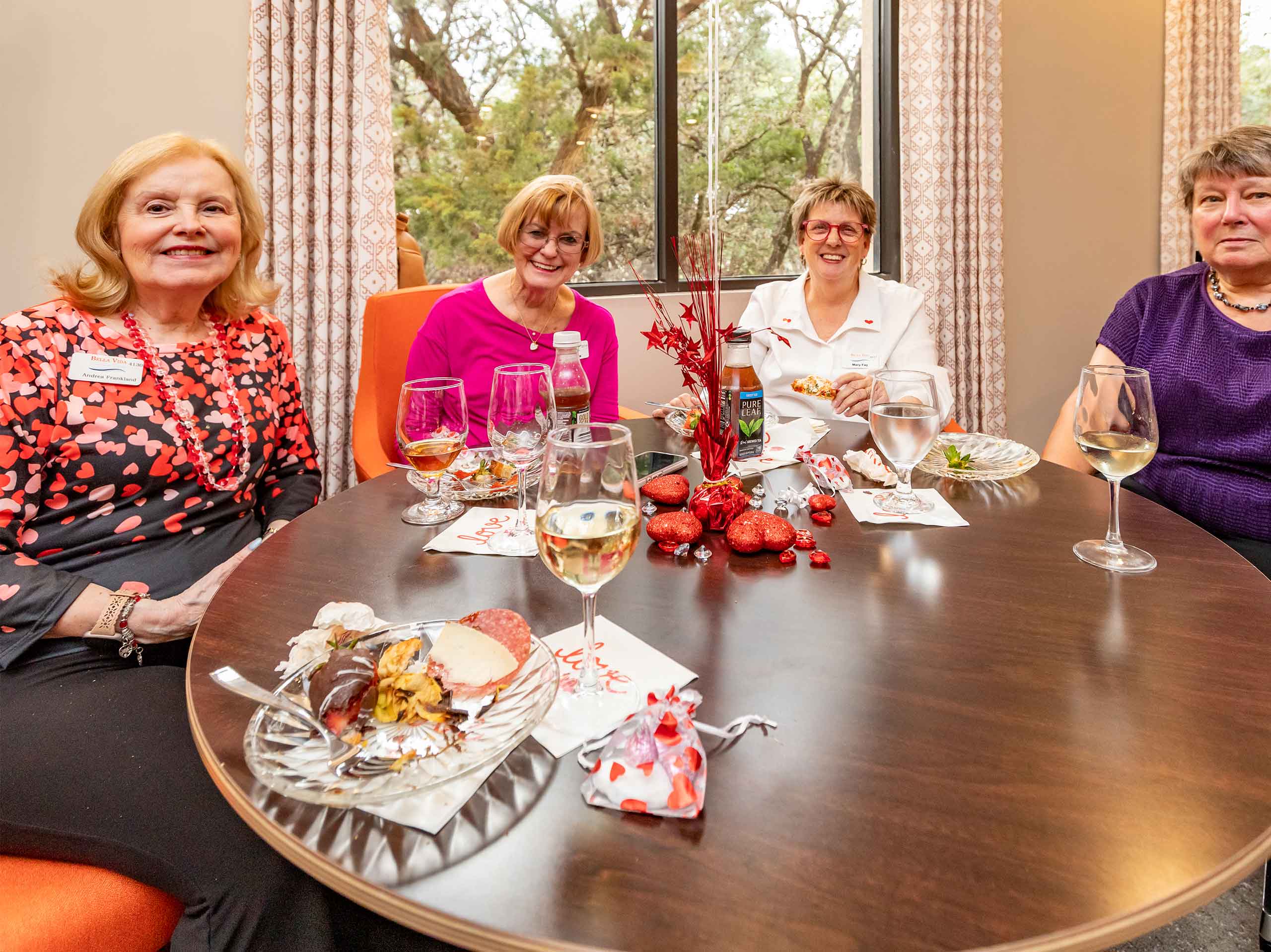 Bella Vida construction site with crews working on site walls, utilities, concrete slabs, and new framing at the Memory Care building, Phase 3 villas, and quadplex foundations.