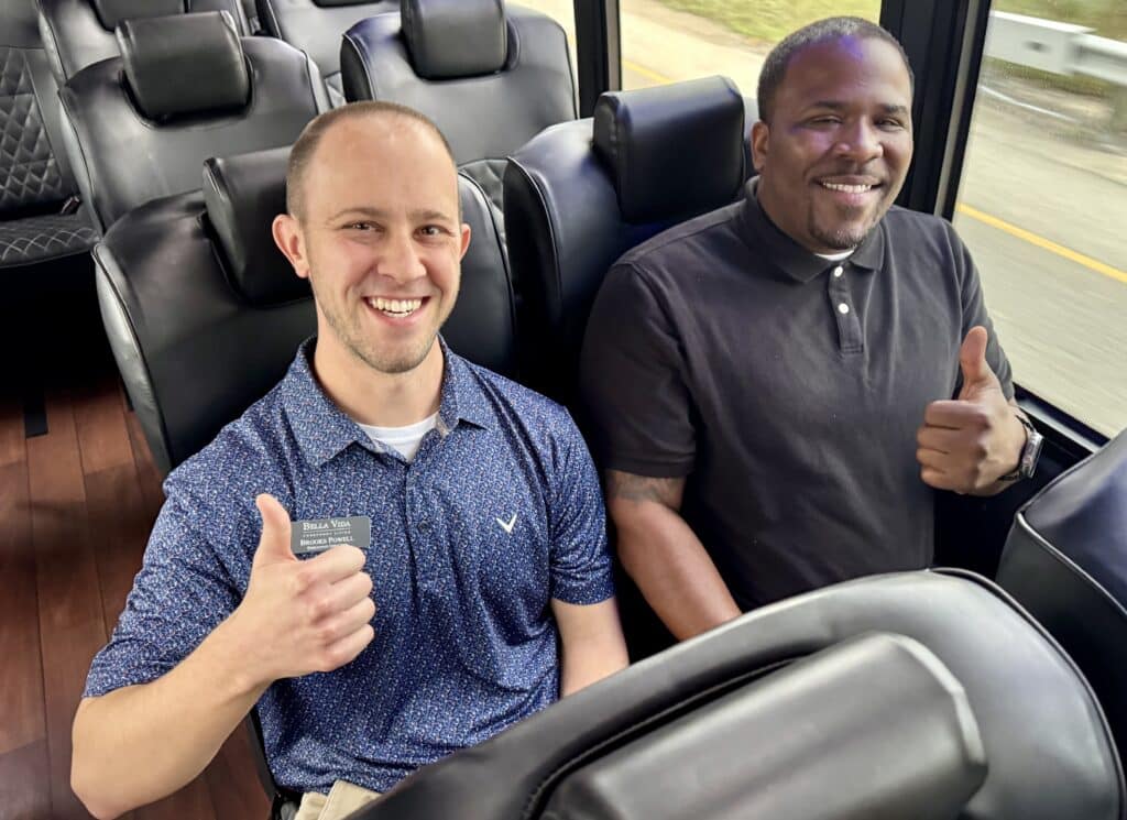 Bella Vida team members Brooks Powel and Germain Owens, during a bus tour of the construction area